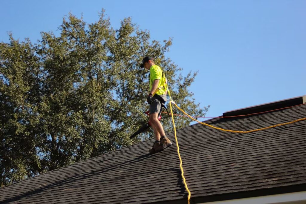 Roofing crew working on a residential roof replacement