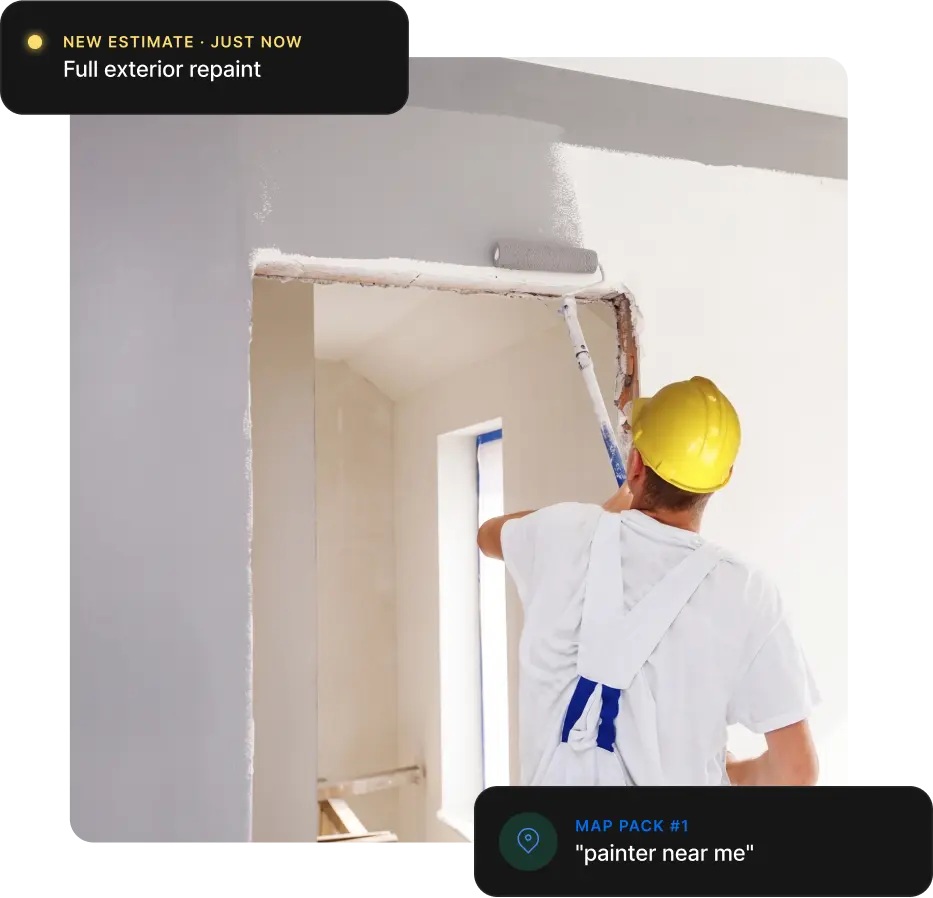 House painter rolling primer onto an interior wall and ceiling